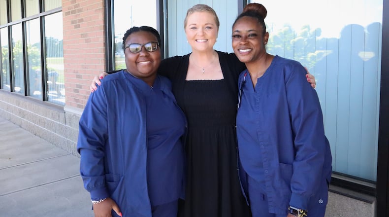 A top Butler Tech official battling cancer is getting help from two students from the nursing career program she used to oversee. It’s a full circle of caring and an unexpected but greatly appreciated one, said Dr. Sarah DeLong, former dean of Butler Tech’s healthcare programs and now director of the career school system’s adult education programs. DeLong, center, recently met at Butler Tech with Ronesia Stone (left) and Jada Calhoun. (Provided)