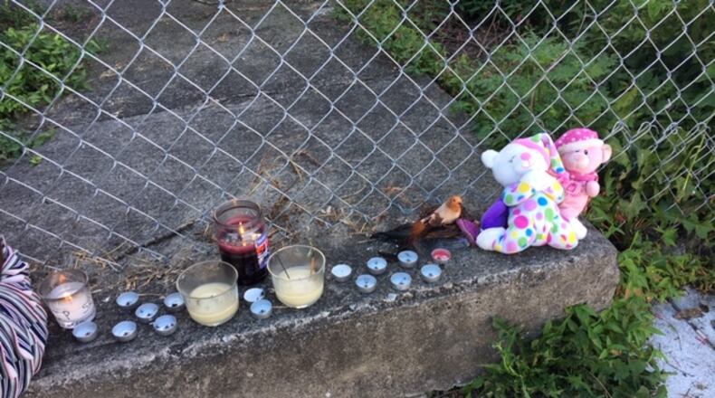 A makeshift memorial near where Shon Walker was shot and killed on East Avenue Thursday night