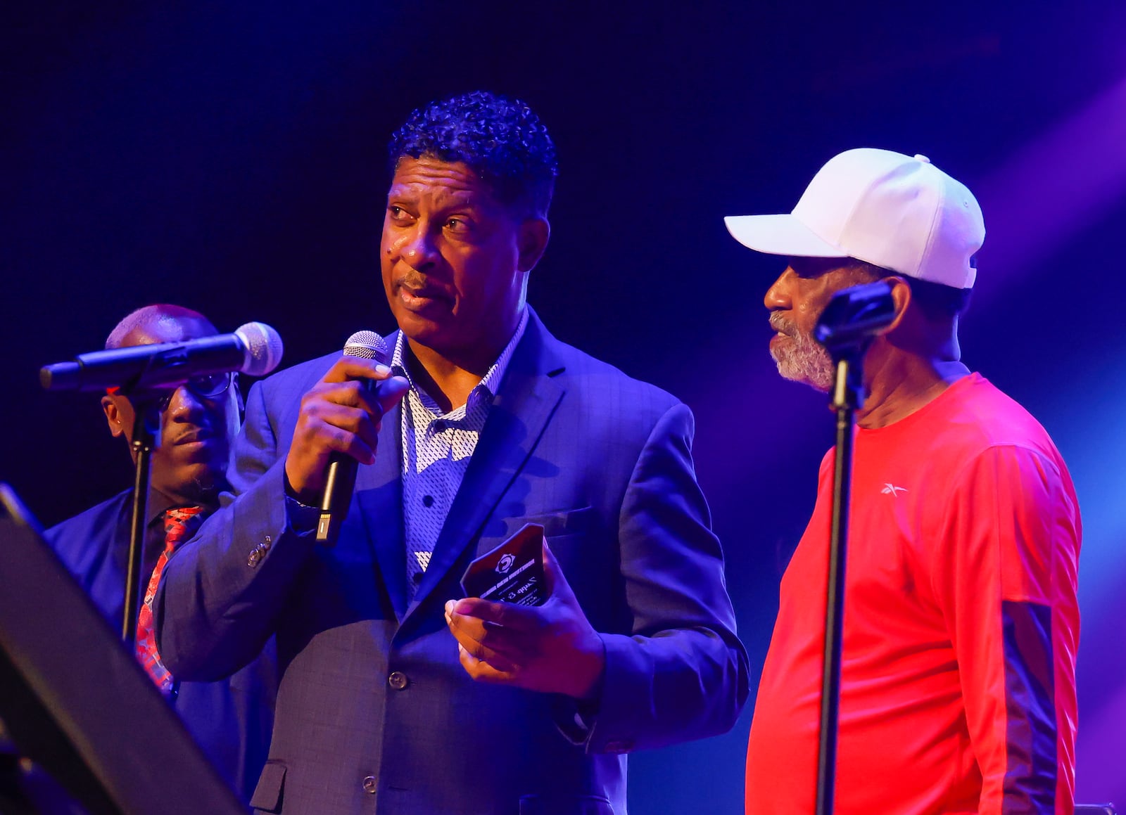 Middletown Rocks event Thursday, June 26, 2025 at Sorg Opera House in Middletown brought local talent to the stage to raise money for Community Building Institute. Lester Troutman, left, accepted the Hometown Hero Award for his band, Zapp & Roger, presented by fellow local musician Jimmy Stewart. NICK GRAHAM/STAFF