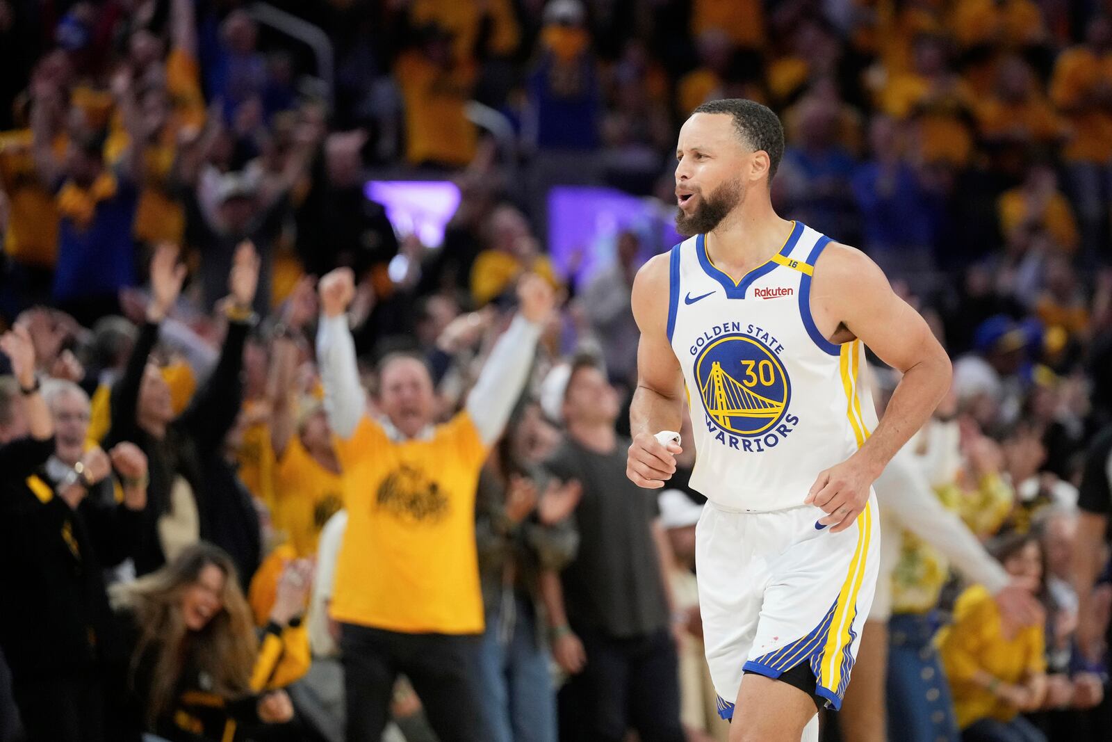 Golden State Warriors guard Stephen Curry (30) celebrates after making a 3-point basket during the second half of Game 3 of an NBA basketball first-round playoff series against the Houston Rockets in San Francisco, Saturday, April 26, 2025. (AP Photo/Jeff Chiu)