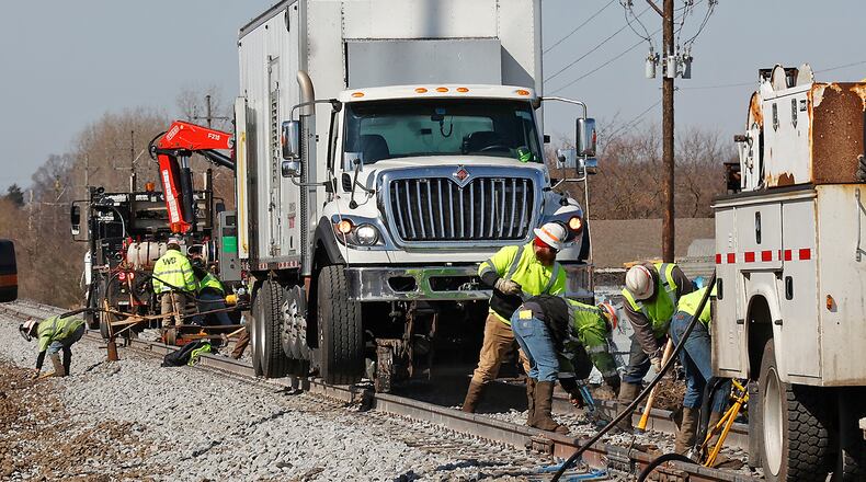 Workers are still cleaning up and repairing the railroad tracks Thursday, March 9, 2023 west of State Route 41 following Saturday's derailment. BILL LACKEY/STAFF
