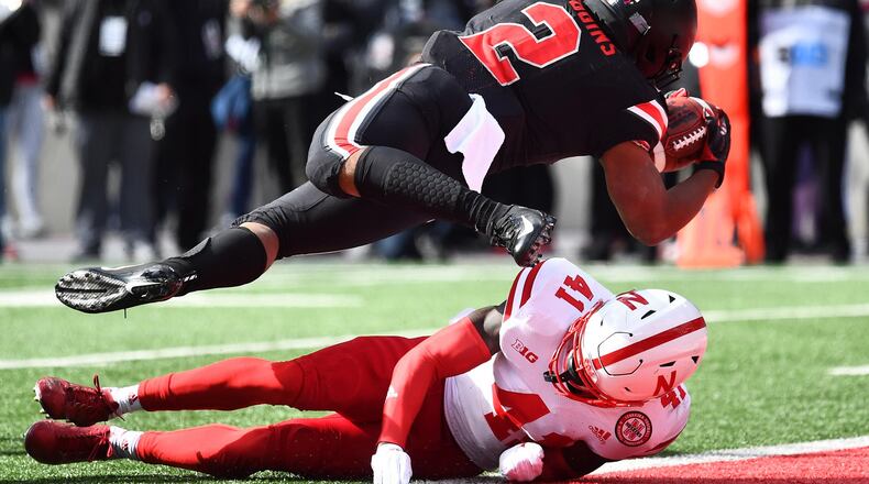 J.K. Dobbins of the Ohio State scores a touchdown on a 10-yard run in the first quarter over the defense of Deontai Williams of Nebraska. JAMIE SABAU / GETTY IMAGES