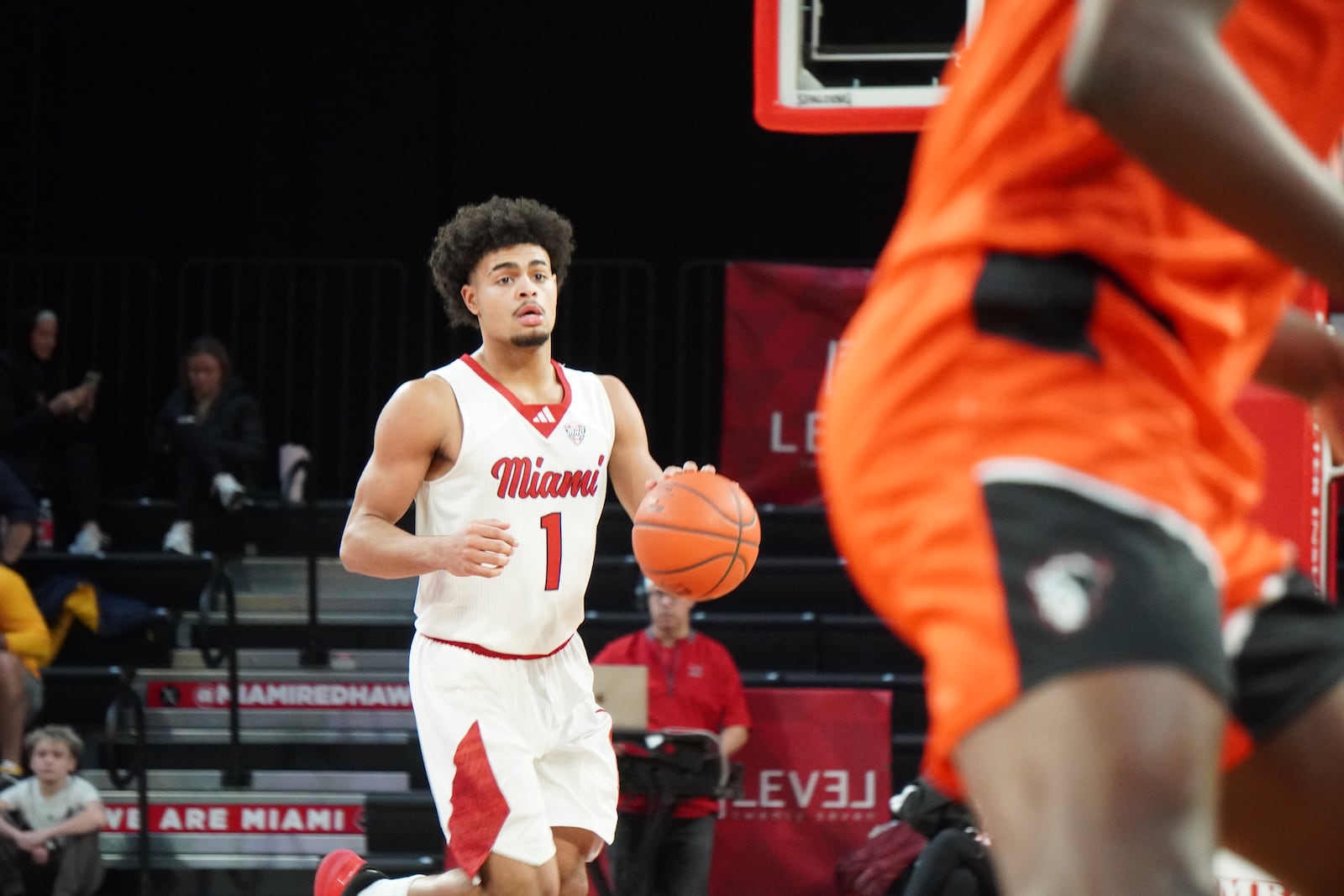 Miami’s Trey Perry dribbles the ball up court against Milligan on Monday afternoon at Millett Hall. CHRIS VOGT / CONTRIBUTED