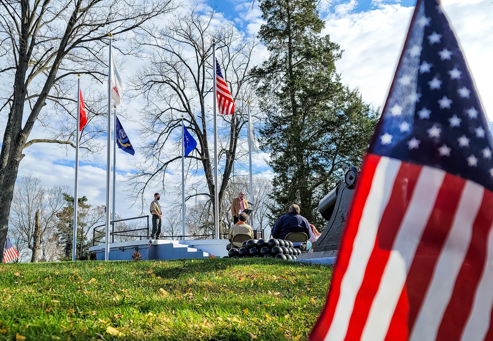 Xander Roberts with Boy Scout Troop 956 presented his Eagle Scout project "Flags for the Fallen" at Greenwood Cemetery on veterans day Wednesday Nov. 11, 2020 in Hamilton. Roberts lead the project and with the help of others and over $10,000 in donations added flag poles and flags representing the United States and branches of the military, new paint and more to renovate a memorial at the cemetery. NICK GRAHAM / STAFF