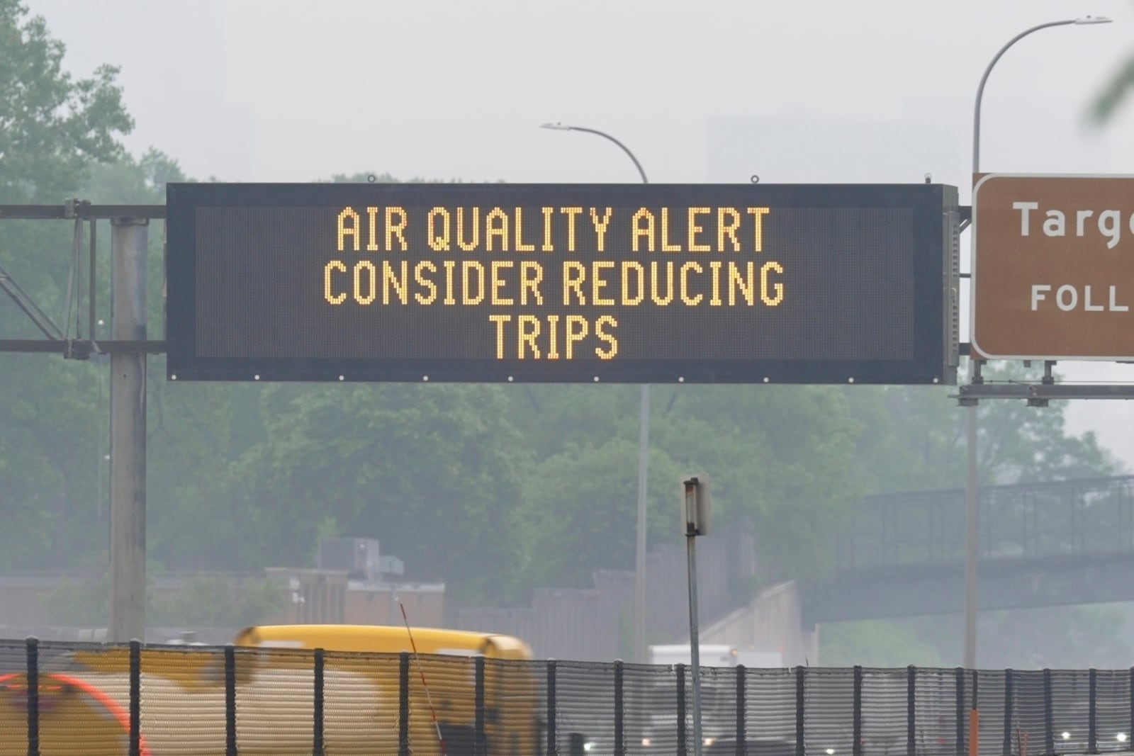 A sign warns of an air quality alert as smoke from wildfires burning in Canada reaches Minneapolis, Minn., on Tuesday, June 3, 2025. (AP Photo/Mark Vancleave)