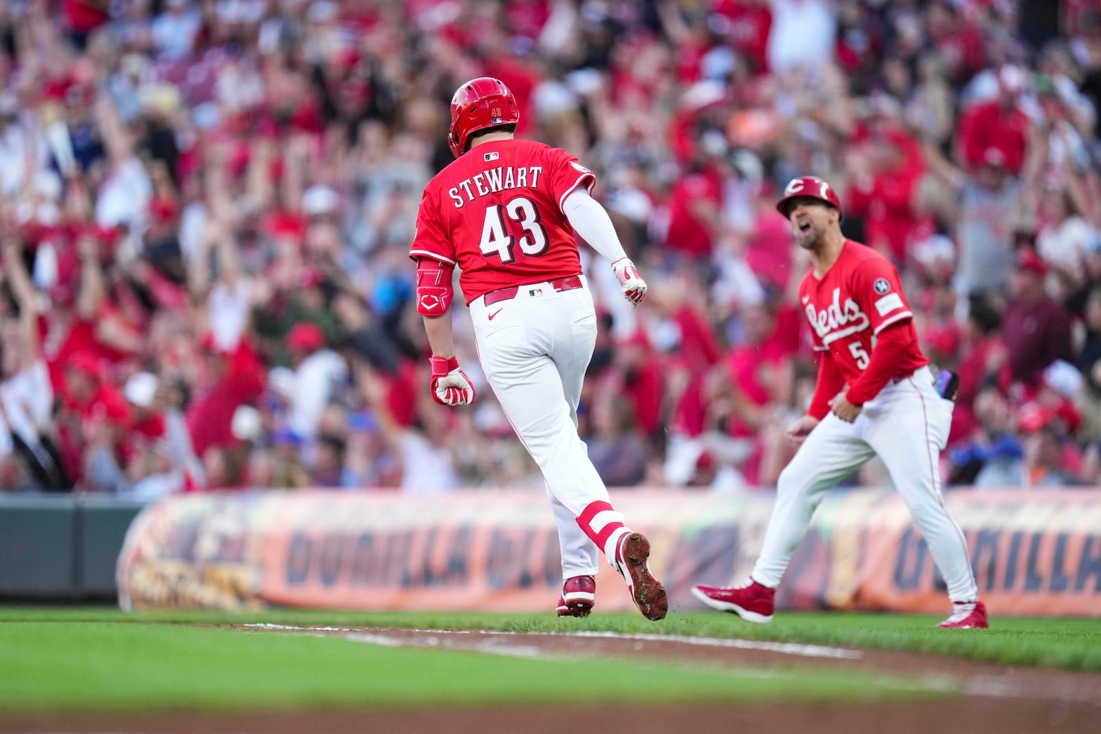 Cincinnati Reds' Sal Stewart (43) rounds the bases after hitting a two-run home run during the second inning of a baseball game against the New York Mets, Saturday, Sept. 6, 2025, in Cincinnati. (AP Photo/Jeff Dean)
