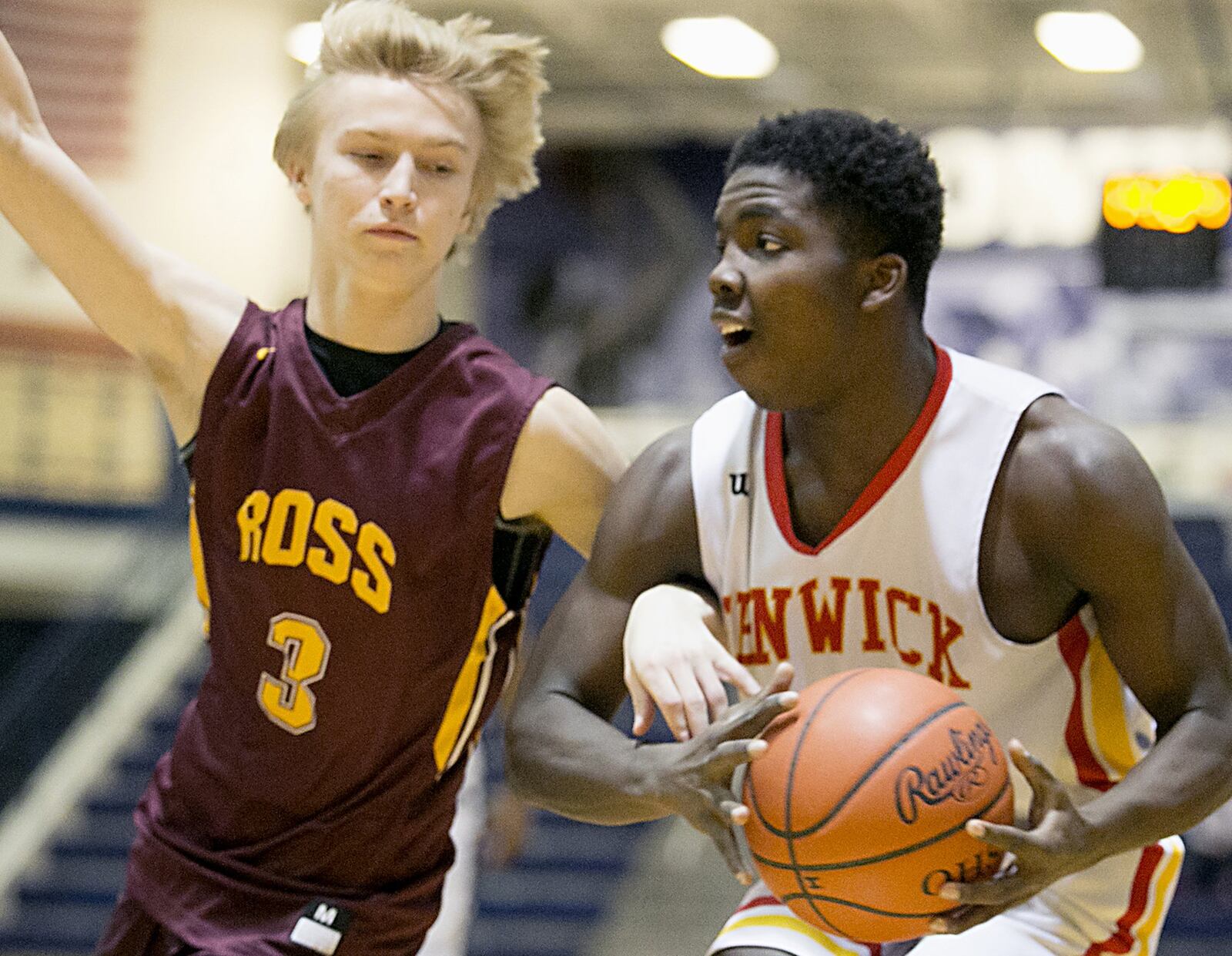 Fenwick guard Caleb Davis is covered by Ross guard Dylan Zimmerman during the All-Butler County All-Star boys basketball game at the Hamilton Athletic Center on Saturday night. CONTRIBUTED PHOTO BY E.L. HUBBARD