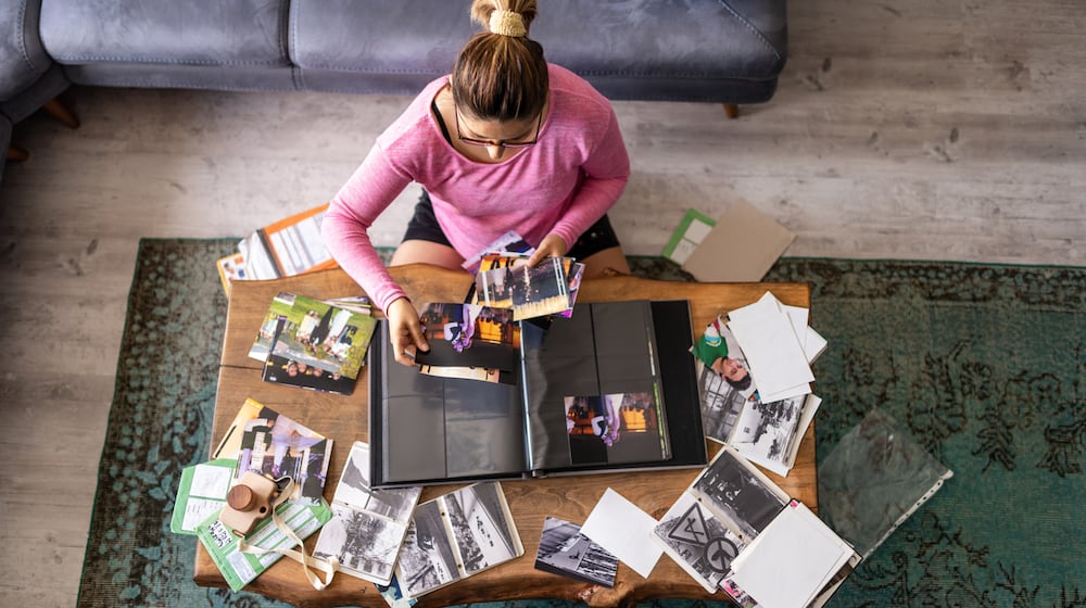 Organizing photos is something to do when stuck inside your home due to inclement weather. ISTOCK