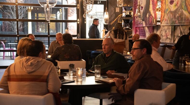 People dine at Son of a Butcher, an upscale restaurant in Liberty Center in Liberty Twp. CONTRIBUTED