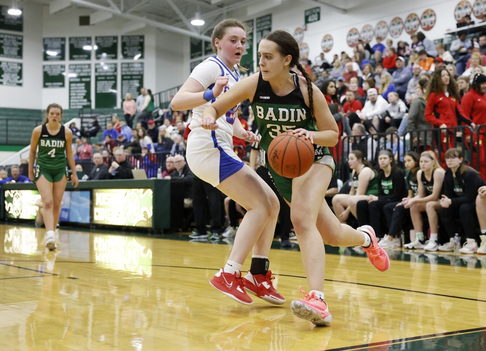 Badin's Lauren Christie dribbles the ball defended by Carroll's Maura Petrovic during their Division II District final basketball game Friday, Feb. 24, 2023 at Mason Middle School. Badin won 53-39. NICK GRAHAM/STAFF