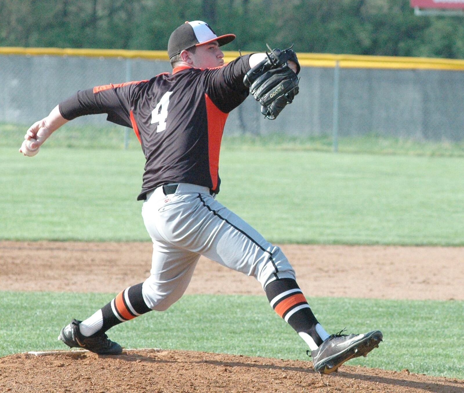 Waynesville pitcher Brady Stone deals to the plate Monday during a 7-0 win over Carlisle in Southwestern Buckeye League Buckeye Division baseball action at Sam Franks Field in Carlisle. RICK CASSANO/STAFF