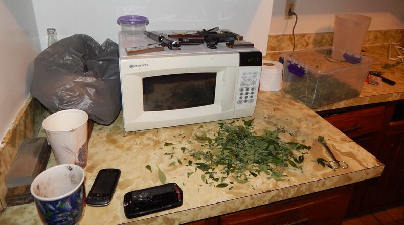The Butler County Sheriff’s Office and Hamilton Police Department jointly executed a search warrant Tuesday, April 7, at 220 North D St. in Hamilton, where they found and confiscated approximately 63 marijuana plants and two loaded handguns.