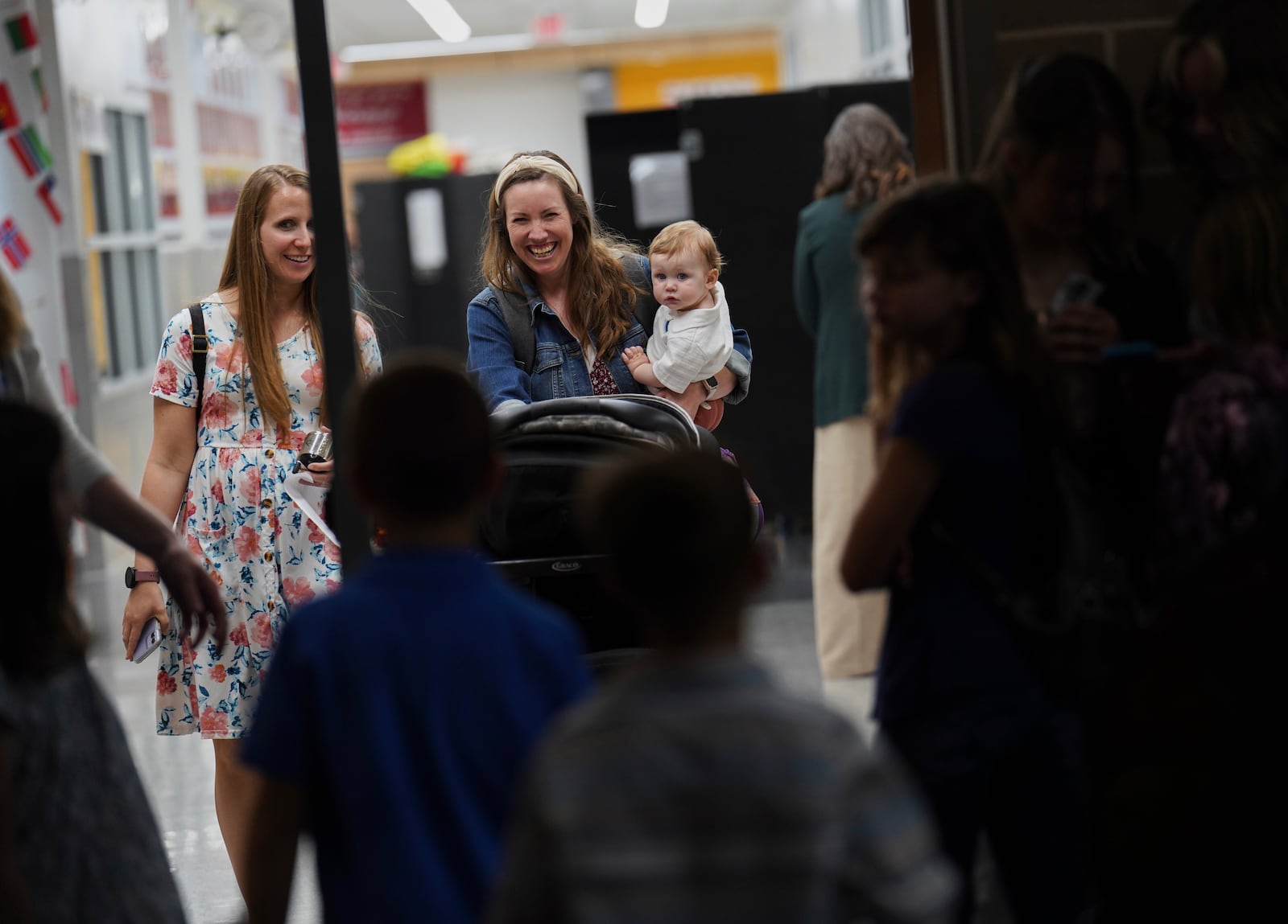 Joi Rogers walks into church with one of her children on Sunday, April 6, 2025, at Pillar Church in Dumfries, Va. (AP Photo/Jessie Wardarski)