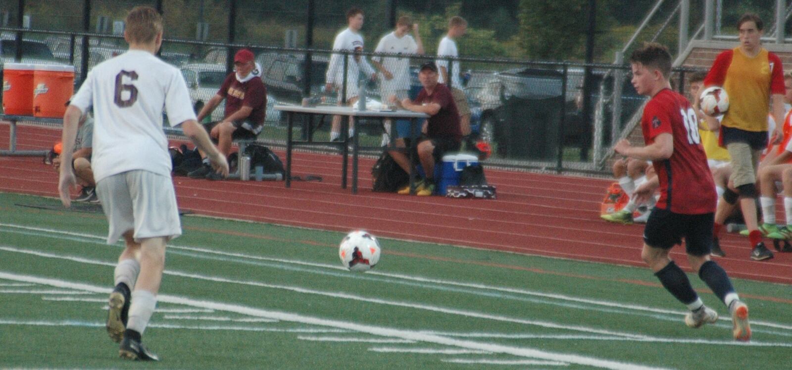 Talawanda’s Nate Vidourek (18) eyes the ball as Coltin Harris (6) of Ross draws closer Tuesday night during a 3-0 THS victory in Oxford. RICK CASSANO/STAFF