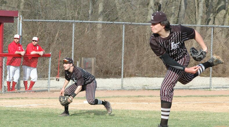 Lakota East pitcher Nate Haberthier delivers to the plate as third baseman Mitchell Vincent takes a defensive position during Wednesday’s Greater Miami Conference baseball game at Fairfield’s Joe Nuxhall Field. East won 2-1. RICK CASSANO/STAFF
