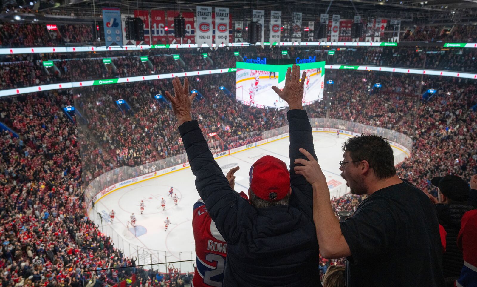 Montreal Canadiens fans react after a goal over the Carolina Hurricanes during first period NHL hockey action in Montreal on Wednesday, April 16, 2025. (Christinne Muschi/The Canadian Press via AP)