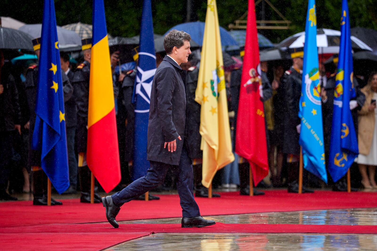 Romania's newly elected president Nicusor Dan reviews the honour guard during a welcoming ceremony at the Cotroceni Presidential Palace, after being sworn in at the parliament, in Bucharest, Romania, Monday, May 26, 2025. (AP Photo/Andreea Alexandru)