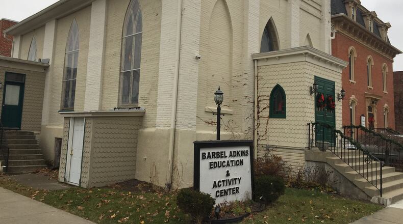 The former Trinity Episcopal Church on East Franklin Street in Troy — here shown as the Adkins Center — may be demolished to accommodate expansion of the Franklin House shelter next door (right). NANCY BOWMAN / STAFF