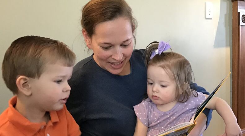 Brenda Herring says she typically reads to her two younger children, Bryson, 3, and Rylee, 14 months, twice a day. Introducing her four children to reading will help them in school and the rest of their lives, she believes.