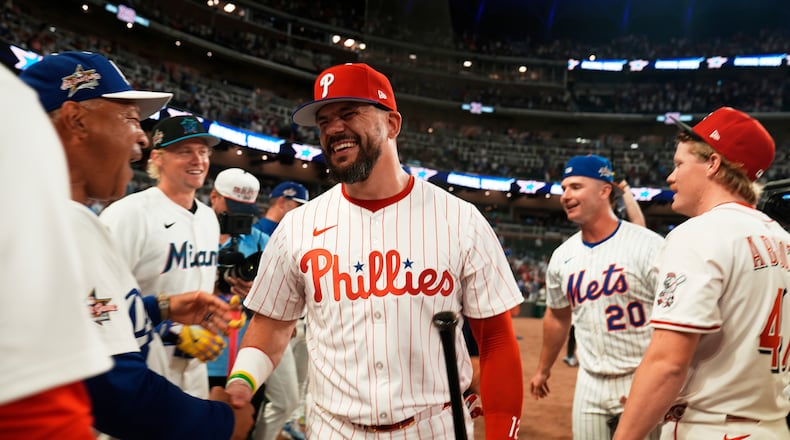 Philadelphia Phillies Kyle Schwarber celebrates after winning the tiebreaker at the MLB baseball All-Star game between the American League and National League, Tuesday, July 15, 2025, in Atlanta. (AP Photo/Brynn Anderson)