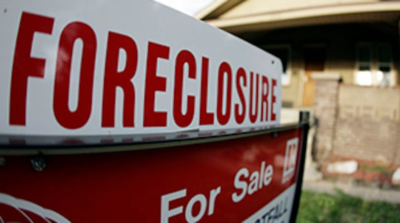 Foreclosures are slowing to such an extent banks are now seizing the homes of people who pay their bills on time. (AP photo from unrelated story)