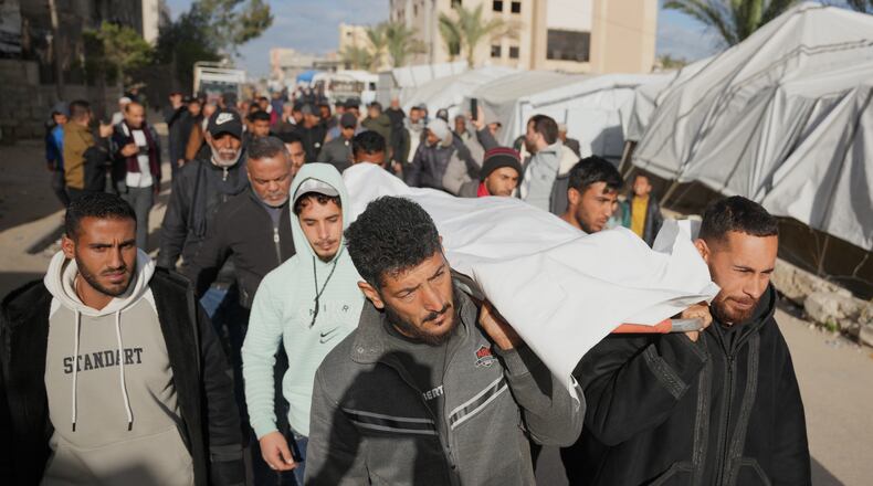 Palestinians carry the body of a man who was killed in an Israeli military strike, during his funeral at Nasser Hospital in Khan Younis , Wednesday, Feb. 4, 2026. (AP Photo/Jehad Alshrafi)
