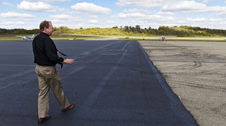 Butler County Regional Airport Manager Ron Davis shows off a newly paved section of asphalt during a tour of the facility in 2015.