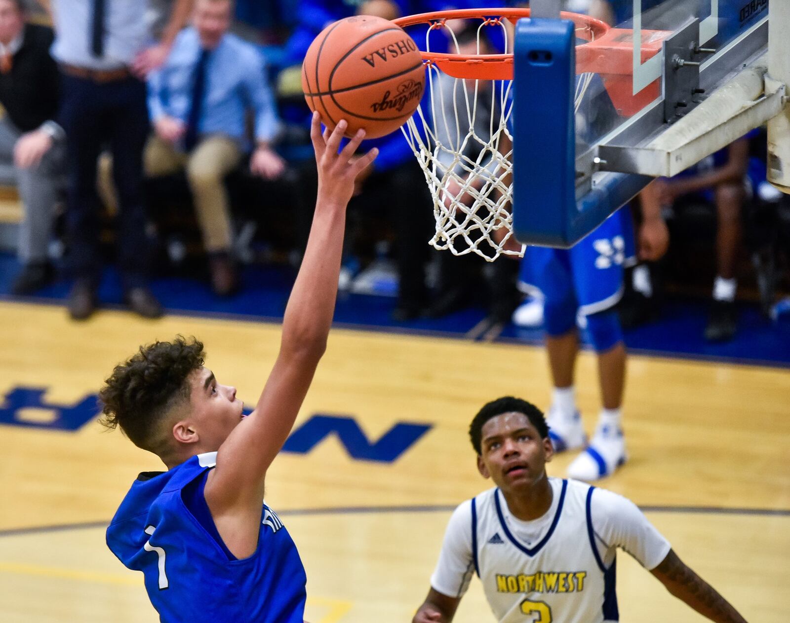 Hamilton’s Trey Robinson goes to the hoop during Friday night’s 58-52 road win over Northwest. NICK GRAHAM/STAFF