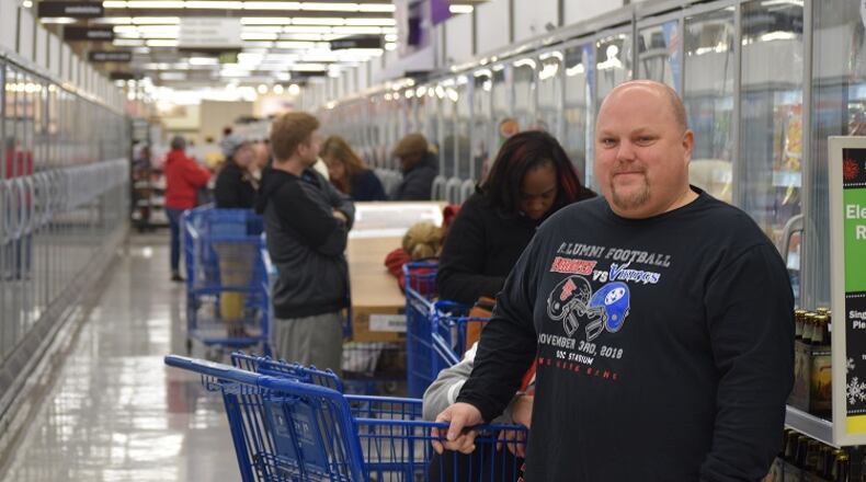 Jason Tharp of Miamisburg was first in line for the 55-inch Element TV with Roku at Meijer Thursday morning.