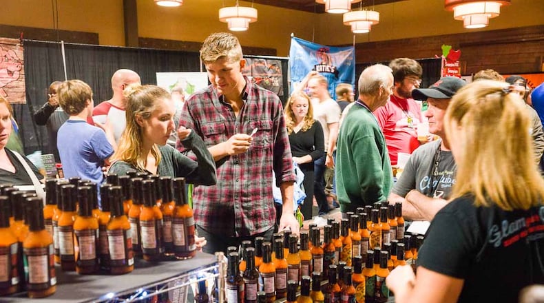 Jungle Jim’s Weekend of Fire is a two-day event that will run from 11 a.m. to 6 p.m. Aug. 24, and 11 a.m. to 4 p.m. Aug. 25. Pictured are foodies tasting samples at a previous Weekend of Fire. CONTRIBUTED