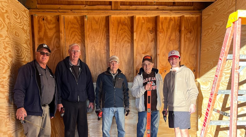 Kiwanis volunteers Dave Mabry, John Skillings, Bill Wortman, Jim Kehr and Douglas Ingram stand inside the shed under renovation. CONTRIBUTED