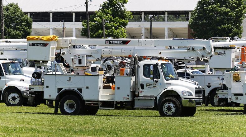 Duke Energy crews are seen in Hamilton in June 2022 after a power outage from a big storm that swept through the region. NICK GRAHAM/FILE