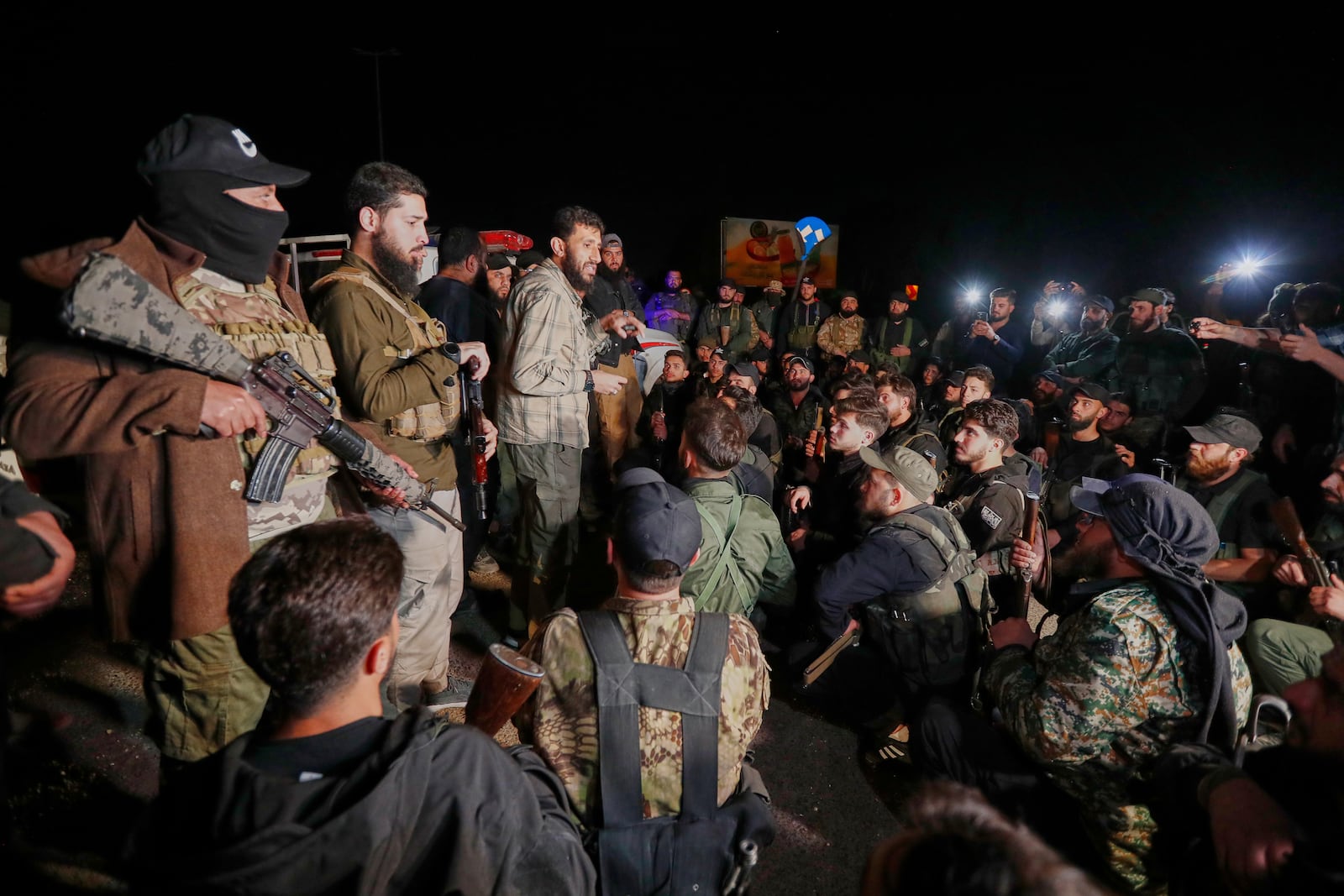 Syria's security forces gather, after reaching a deal with Druze gunmen to deploy around Jaramana, a Damascus suburb that saw fighting earlier this week, in Damascus, Syria, early Friday, May 2, 2025. (AP Photo/Omar Sanadiki)