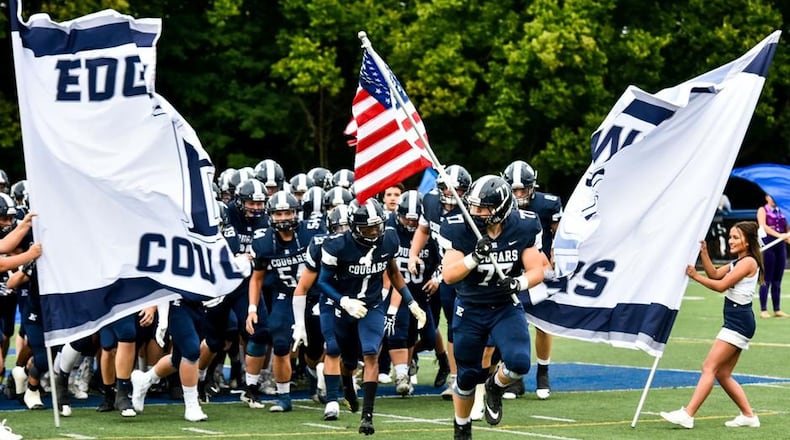 Edgewood’s players take the field before last Friday night’s game against visiting Franklin at Kumler Field in St. Clair Township. NICK GRAHAM/STAFF