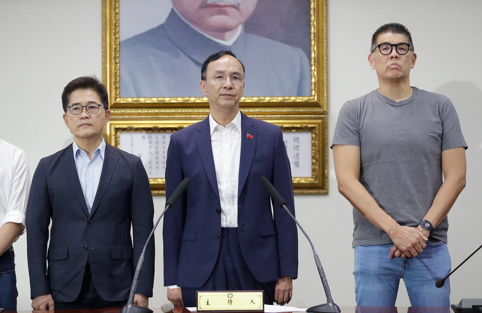 Taiwan Opposition Nationalist Party chairman Eric Chu, center, delivers a speech at a press conference in Taipei, Taiwan, Saturday, July 26, 2025. (AP Photo/Chiang Ying-ying)