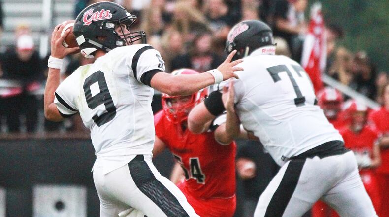 Franklin QB Braden Woods unloads a pass. Franklin defeated host Madison 42-6 in a Week 1 high school football opener on Friday, Aug. 30, 2019. MARC PENDLETON / STAFF