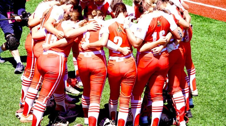 The Fairfield HIgh School softball team huddles up before taking the field vs. Austintown-Fitch in a Division I state semifinal game on Friday at Firestone Stadium in Akron. Chris Vogt/CONTRIBUTED