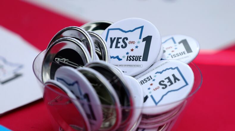 FILE - Buttons in support of Issue 1, the Right to Reproductive Freedom amendment, sit on display at a rally held by Ohioans United for Reproductive Rights at the Ohio Statehouse in Columbus, Ohio, Oct. 8, 2023. (AP Photo/Joe Maiorana, File)