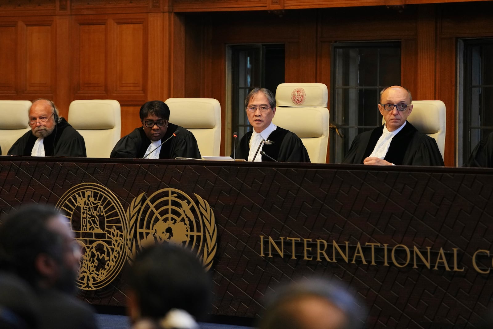 Presiding judge Yuji Iwasawa, second from right, speaks at a hearing to deliver an advisory opinion on what legal obligations nations have to address climate change and what consequences they may face if they don't, Wednesday, July 23, 2025, in The Hague, Netherlands. (AP Photo/Peter Dejong)