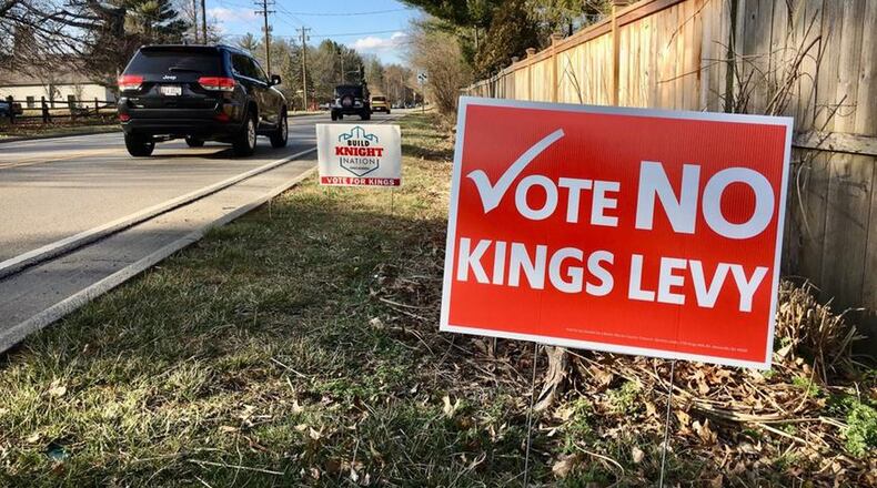 Yard signs for and against a 4.7-mill, $89.9 million bond issue to pay for a new junior high school are dotting Kings neighborhoods in the southern Warren County district. School officials said without the new tax for construction and renovation, the district s consistent high academic standing is threatened. Opponents, however, say the need for a new school is excessive and the district can make do with the current learning spaces. (Photo By Michael D. Clark/Journal-News)