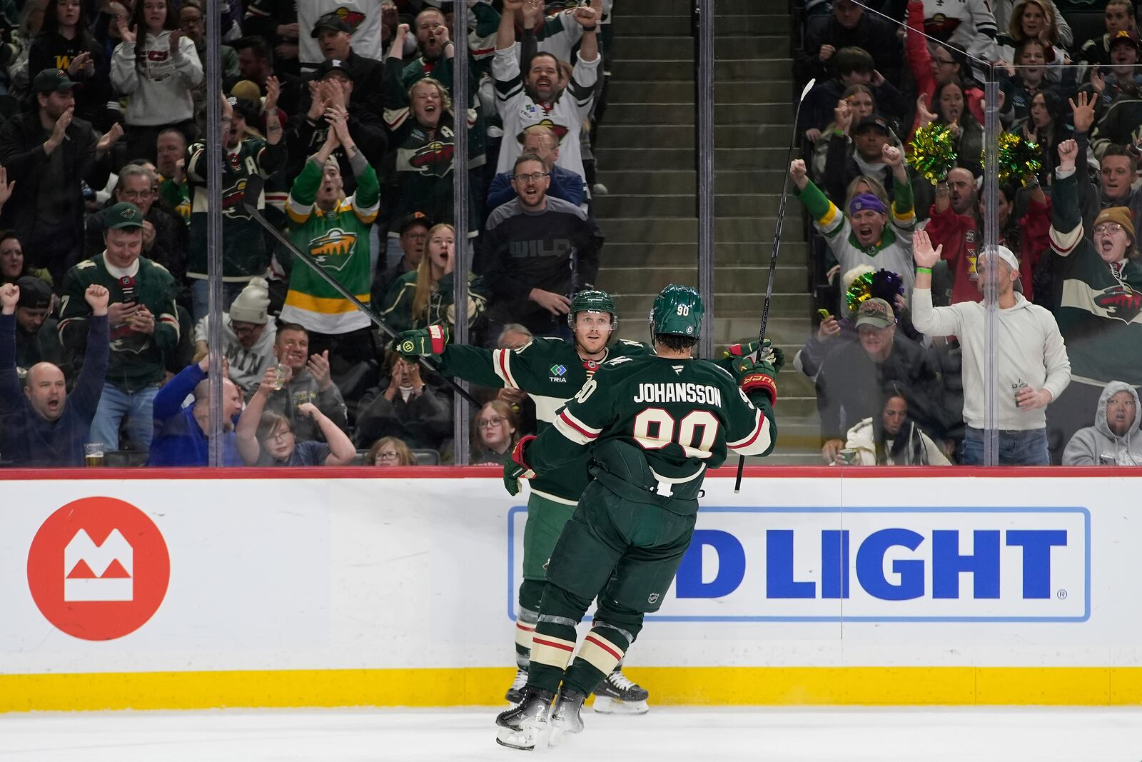 Minnesota Wild left wing Marcus Johansson (90) celebrates toward center Gustav Nyquist (41) after scoring a goal during the first period of an NHL hockey game against the San Jose Sharks, Wednesday, April 9, 2025, in St. Paul, Minn. (AP Photo/Abbie Parr)