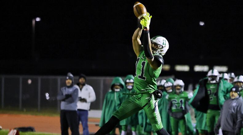 Badin's Braedyn Moore jumps for a catch during a 20-17 loss to Tippecanoe in their Division III Regional Final football game Friday, Nov. 18, 2022 at Trotwood-Madison High School. Moore will play college football at Wisconsin. NICK GRAHAM/STAFF