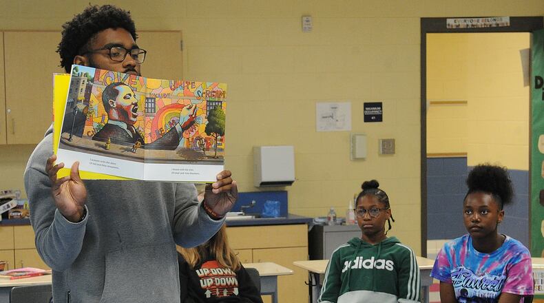 Landon Turner reads to his class during a DPS Summer Camp at Fairview Elementary. MARSHALL GORBY\STAFF