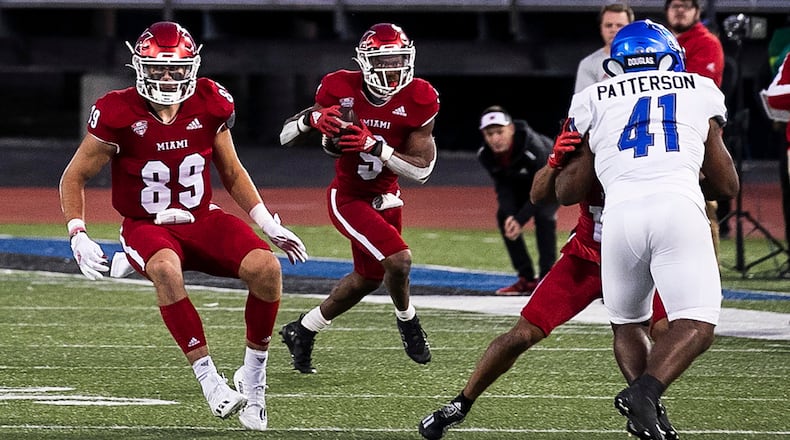 Miami (Ohio) running back Tyre Shelton runs with the ball near tight end Jack Coldiron during an NCAA college football game against Buffalo in Buffalo, N.Y., Saturday, Oct. 1, 2022. (Joseph Cooke/The Buffalo News via AP)