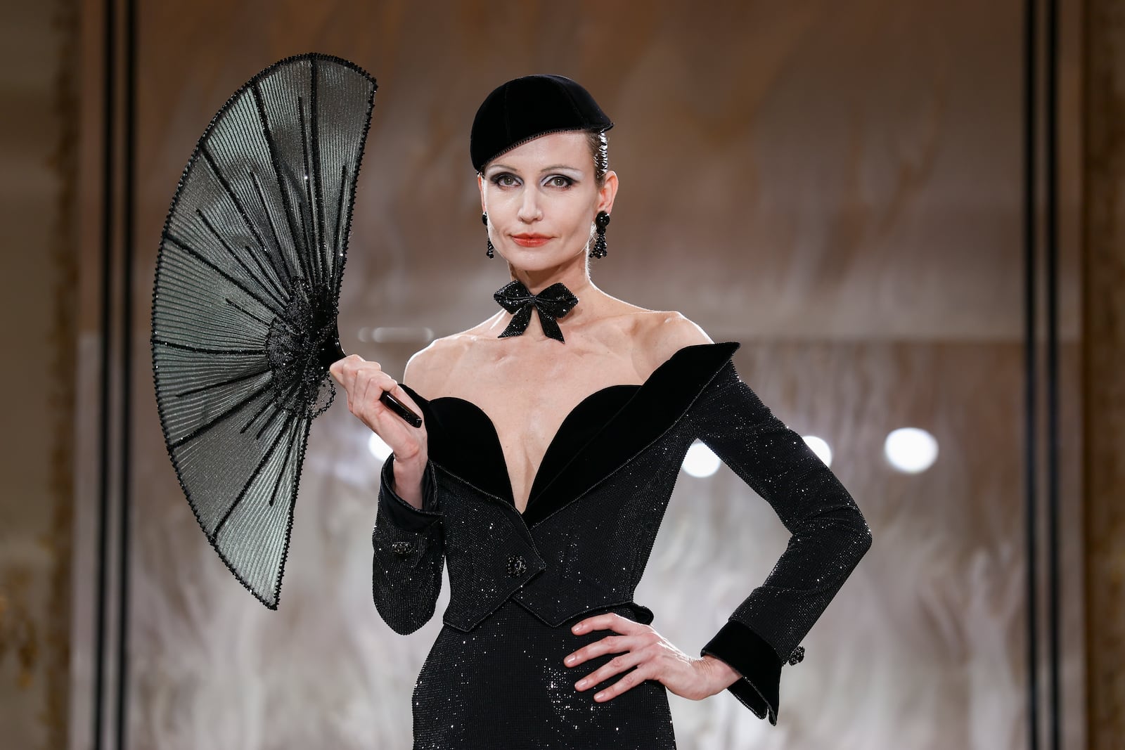 A model wears a creation as part of the Giorgio Armani Prive Fall-Winter 2025/26 Haute Couture collection presented Tuesday, July 8, 2025, in Paris. (AP Photo/Tom Nicholson)