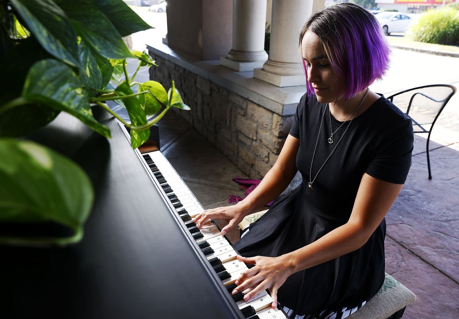 Emily Smith, a piano teacher at Keys to Your Dream in Trenton, has partnered with local businesses to install public pianos with unique art around Trenton. This one is in front of State Street Coffee with several others coming to new locations soon. NICK GRAHAM/STAFF