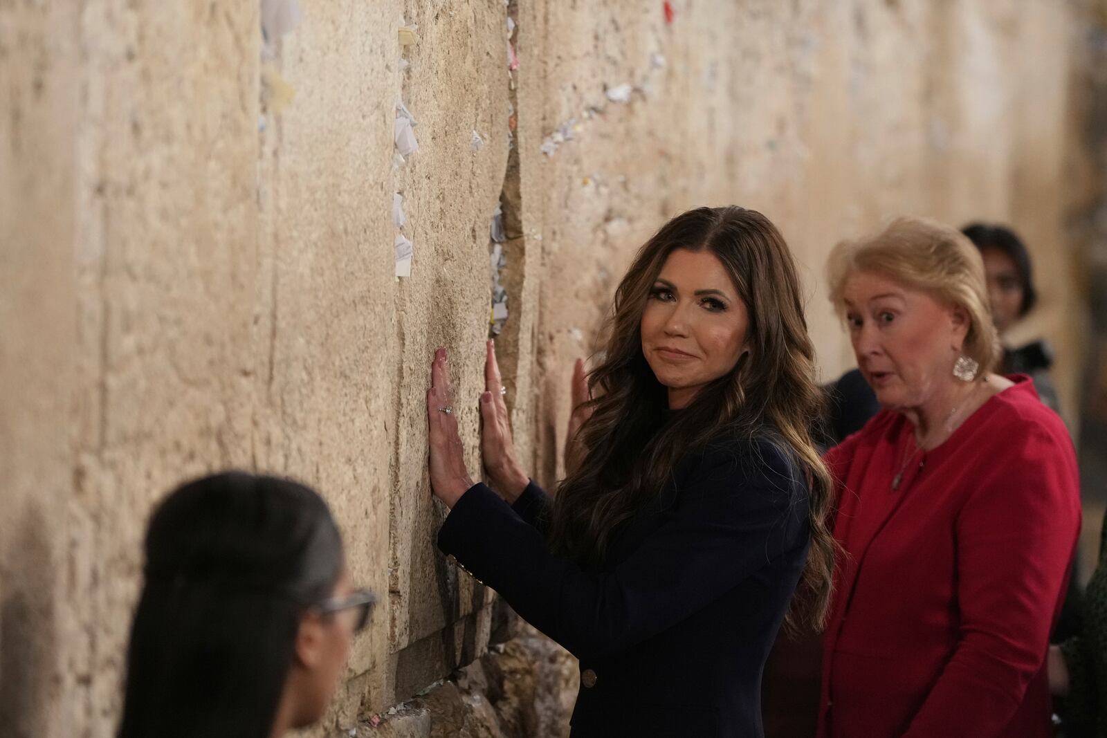 Homeland Security Secretary Kristi Noem visits the Western Wall, the holiest site where Jews can pray, in the Old City of Jerusalem, Sunday, May 25, 2025. (AP Photo/Ohad Zwigenberg)