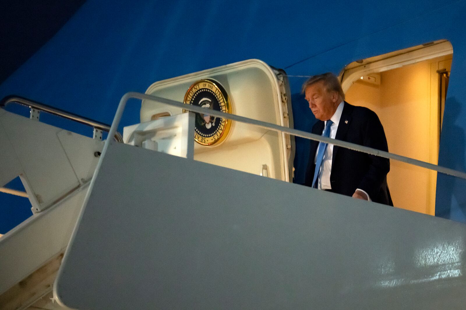 President Donald Trump steps off Air Force One after at Joint Base Andrews, Md., on Tuesday, June 17, 2025, after returning from Calgary, Canada and the G7 Summit. (AP Photo/Mark Schiefelbein)