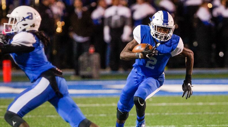 Hamilton's Kaleb Johnson carries the ball during their football game against Sycamore Friday, Oct. 25, 2019 at Virgil Schwarm Stadium at Hamilton High School in Hamilton. Hamilton won 14-7. NICK GRAHAM/STAFF