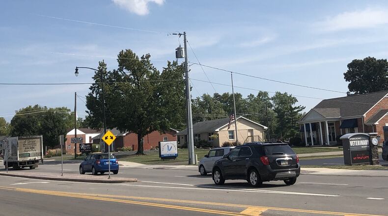 These properties on Central Avenue in Springboro are expected to be in greater demand if they are included in urban village zoning for 62 acres at the city’s center. STAFF/LAWRENCE BUDD